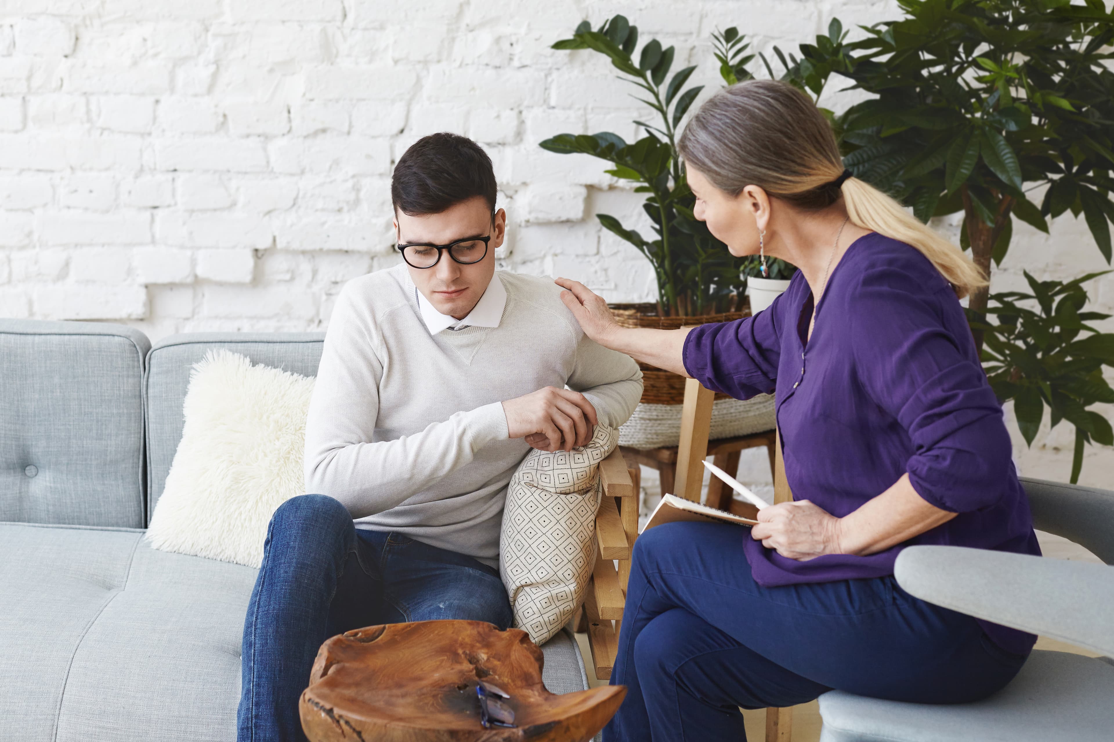 Counsellor supporting a client during a therapy session